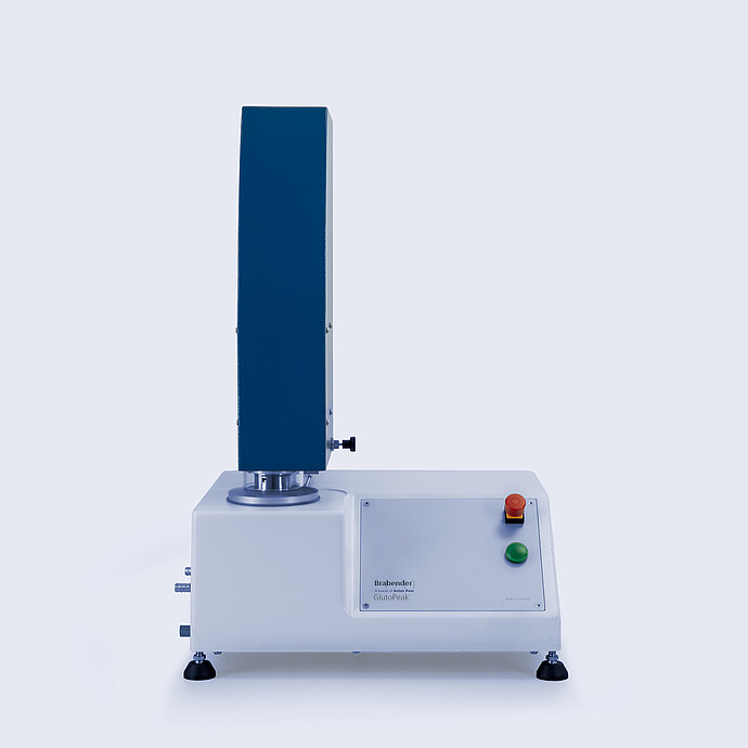 Front view of the Brabender GlutoPeak gluten quality analyzer, showing the control panel, mixing chamber, and upright mo